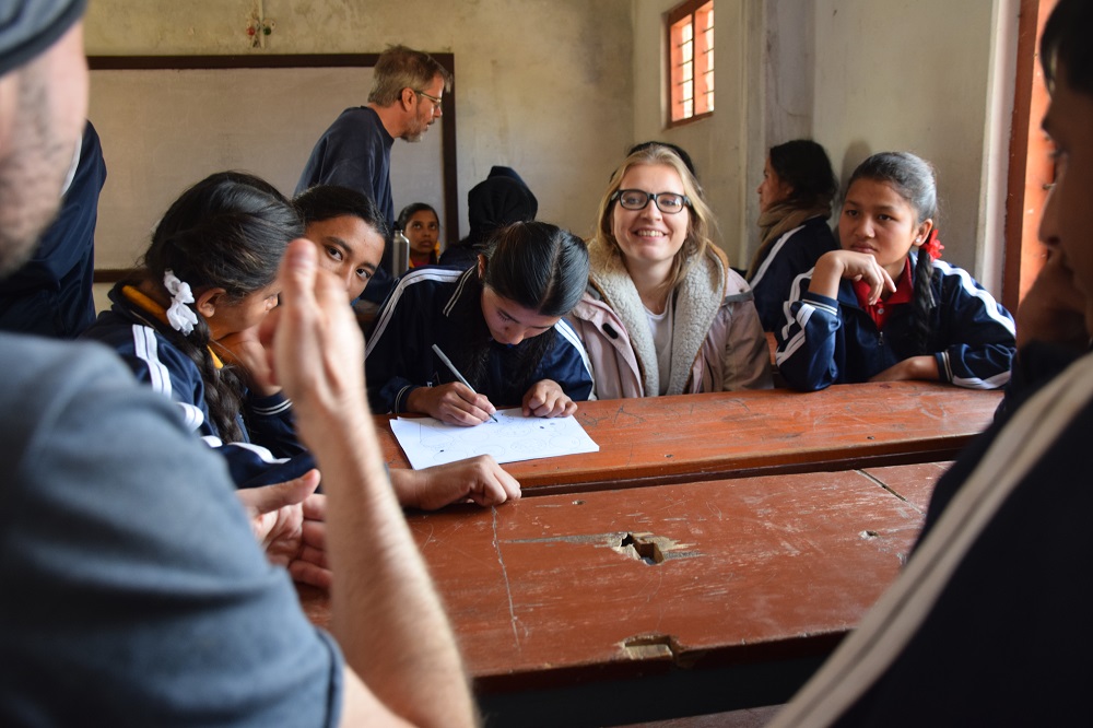 Volunteers and Nepali deaf students working together in teams