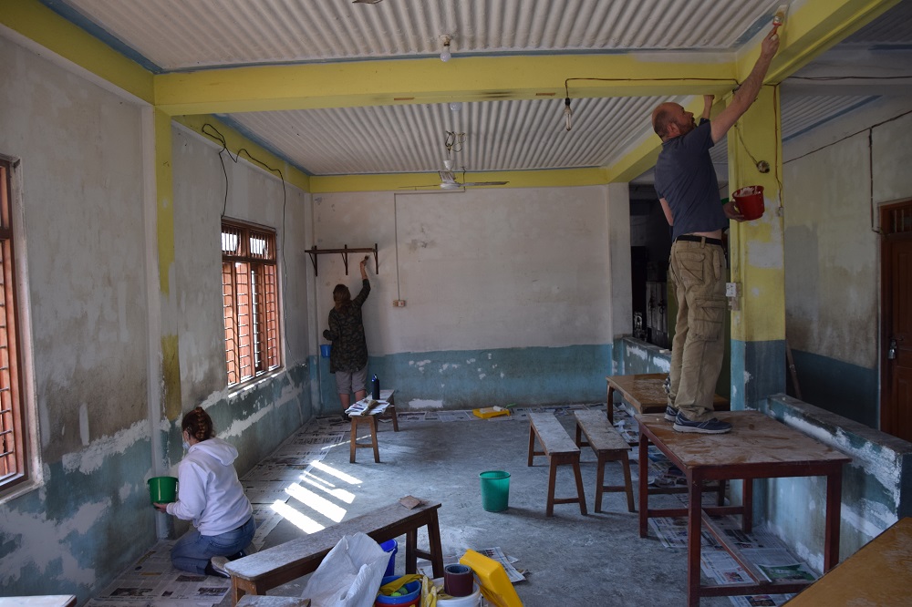 VoluntEars - deaf volunteering overseas. Painting the dining hall at a Deaf school in Nepal